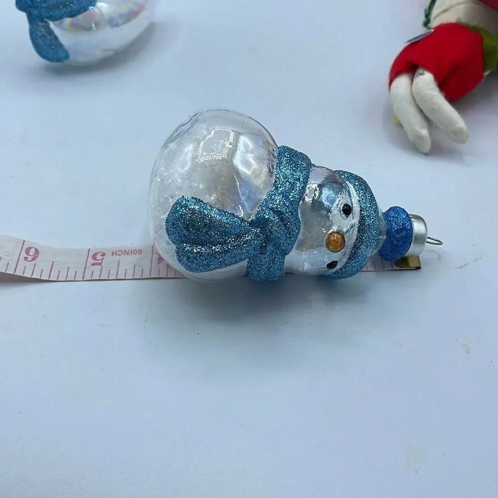 Lot of 2 glass chickadee ornaments with scarves and hats. Faux snow in bottoms.